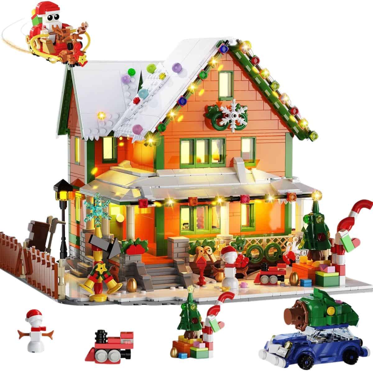 Colorful Christmas house mini building set with holiday lights, wreaths, trees, Santa sleigh, snowman, toy train, and festive decorations.