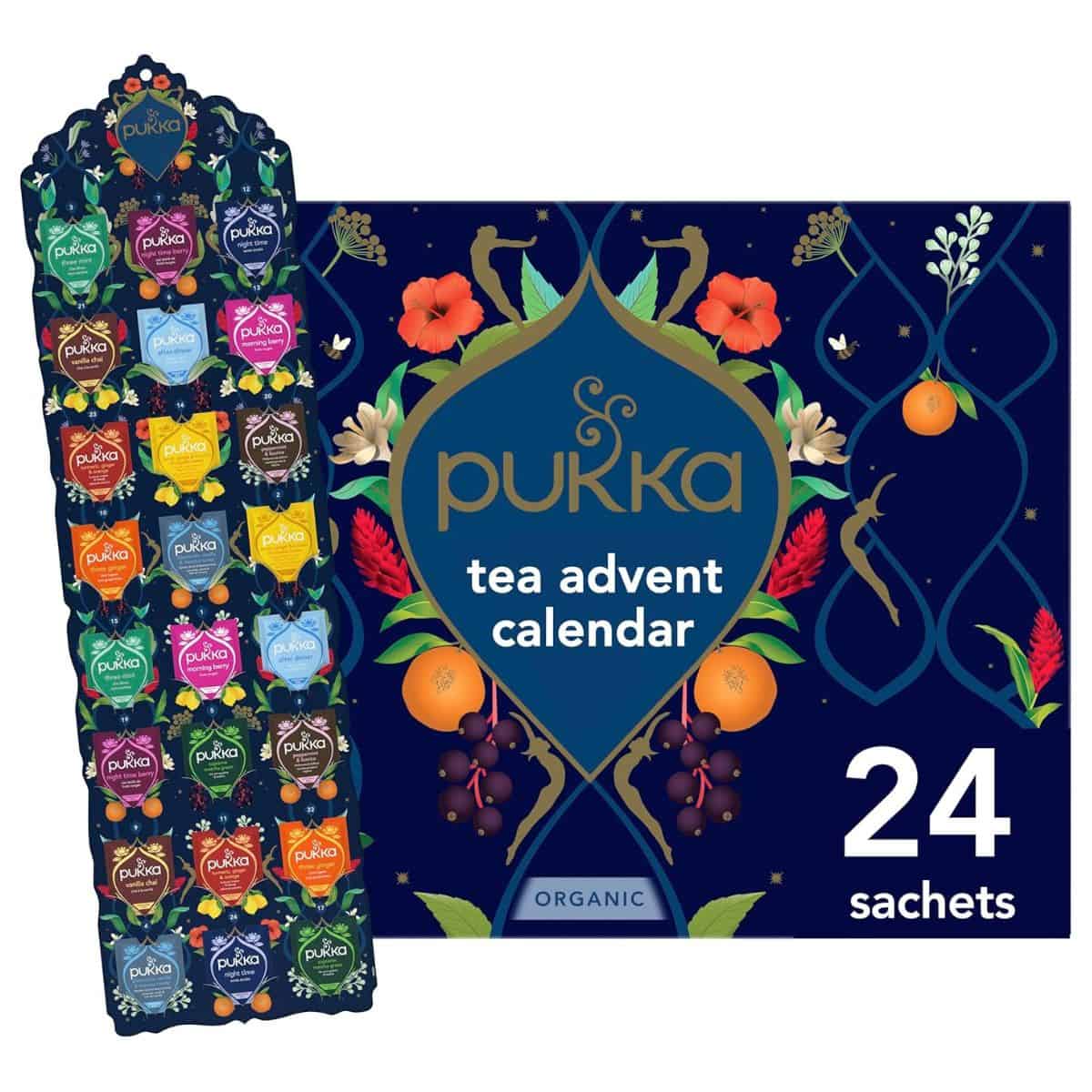 Pukka Tea Advent Calendar with 24 organic tea sachets in assorted flavors, displayed in a festive box with colorful floral and fruit illustrations.