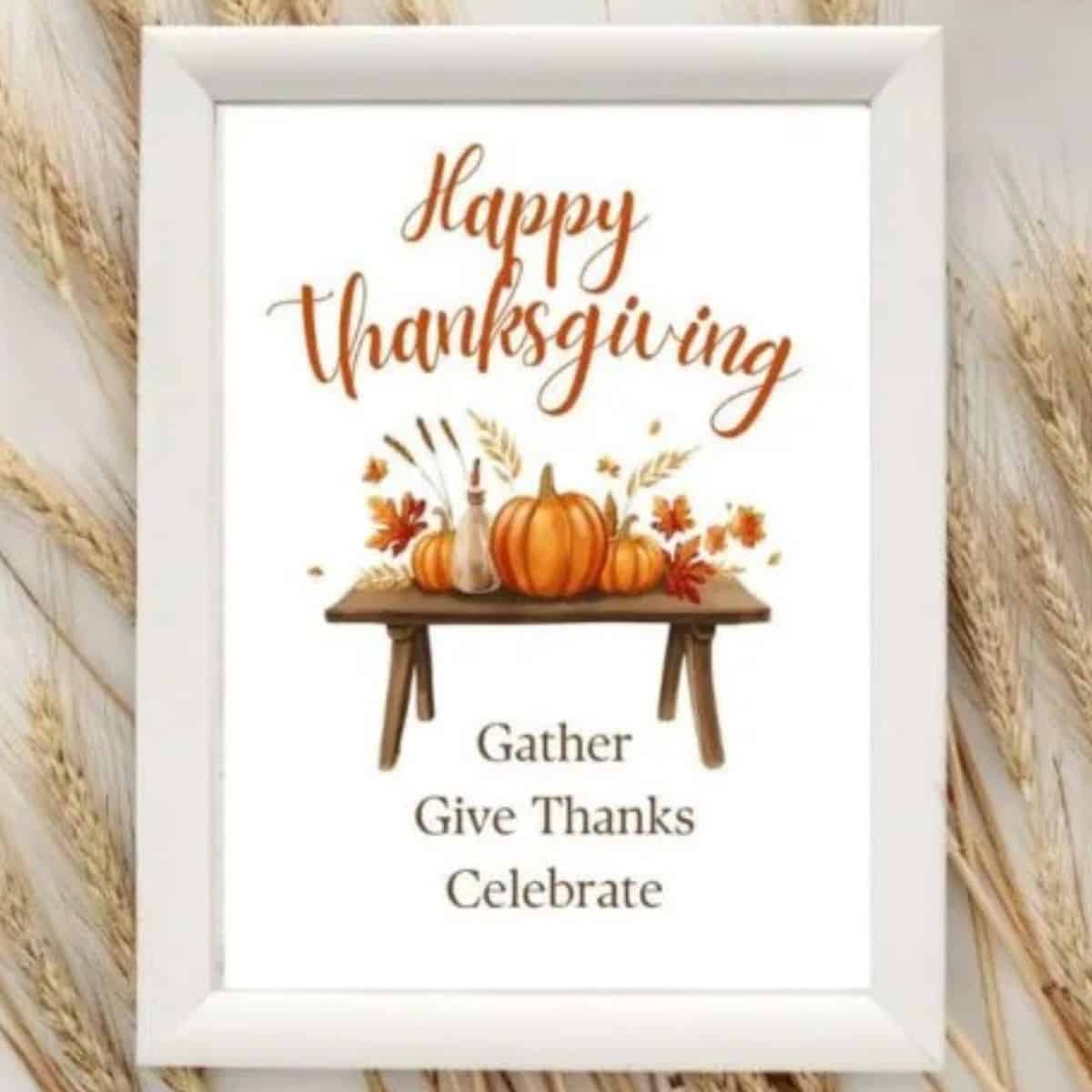 Framed Thanksgiving printable art with pumpkins, fall leaves, and text that says 