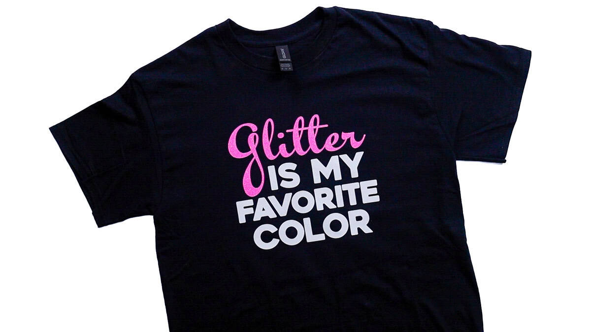 Black t-shirt laid flat featuring the phrase 