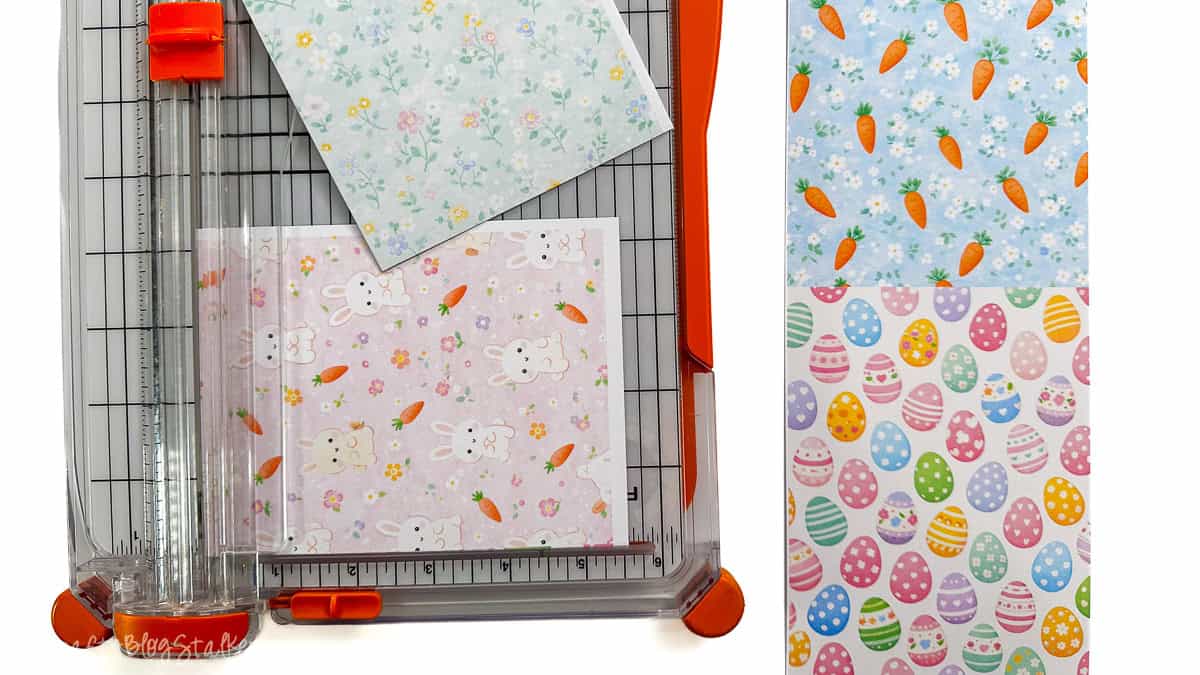 Paper trimmer cutting printed pastel Easter digital papers, with separate sheets showing carrots, eggs, florals, and bunny patterns.