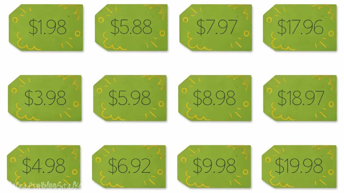 Cricut made baby shower game cards showing product price tags with different dollar amounts used for a Price Is Right style guessing game.