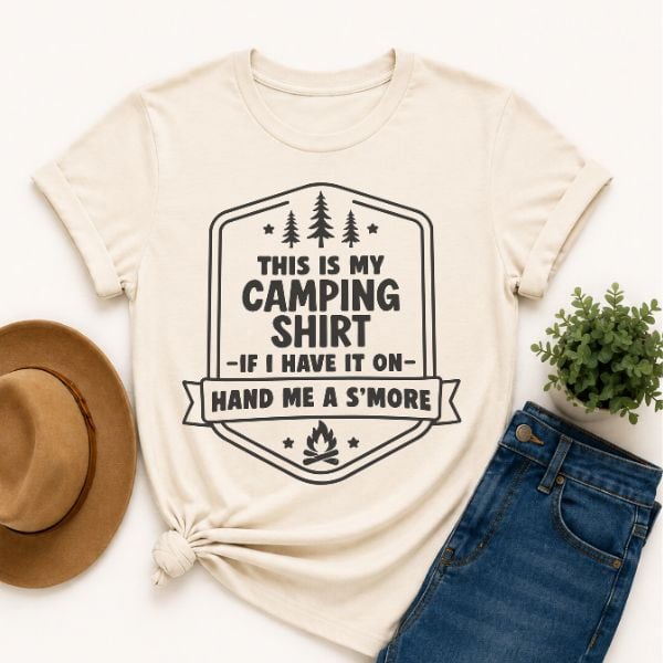 Cream-colored T-shirt with a camping-themed graphic that reads