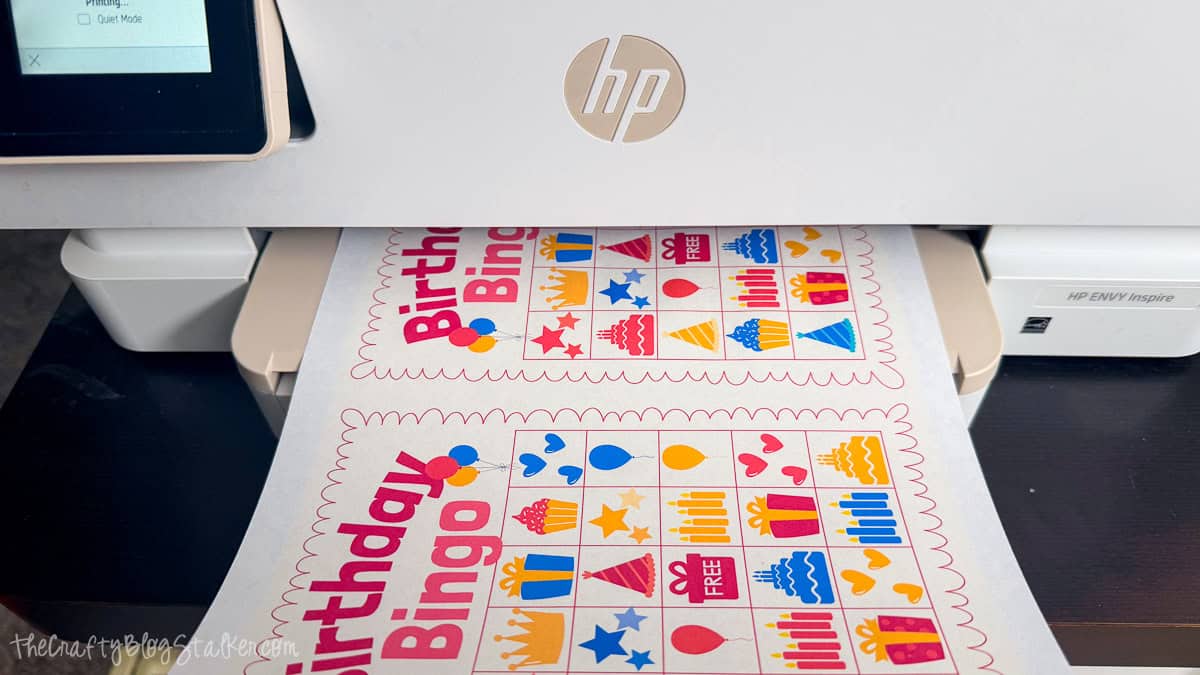 Birthday Bingo cards printing two per page from an HP printer, ready to cut apart for a printable birthday party game.