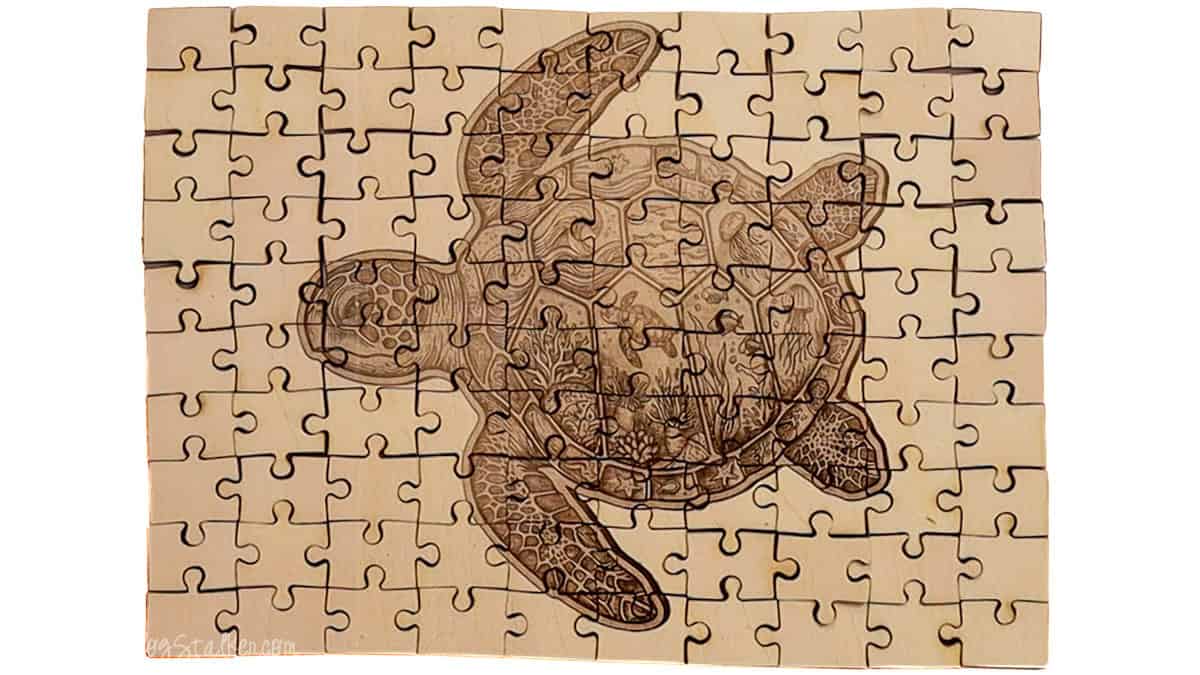 Wooden jigsaw puzzle engraved with a detailed sea turtle design featuring ocean life and coral, shown fully assembled on a light wood surface.