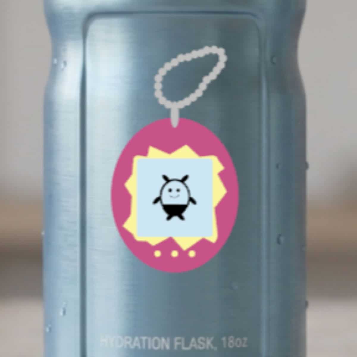 Blue hydration flask decorated with a colorful retro digital pet design featuring a small black and white character.