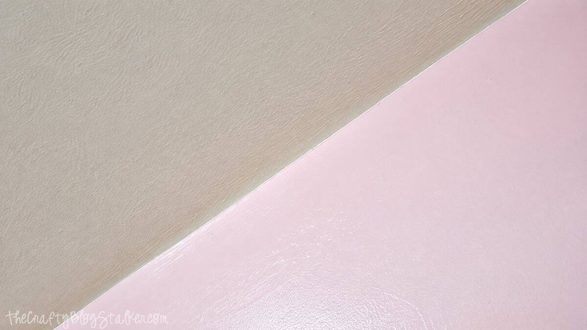 A Pink Shabby Chic Accent wall | Perfect for any little girl! Close-up of a crisp, straight paint line where a soft pink accent wall meets a beige ceiling.