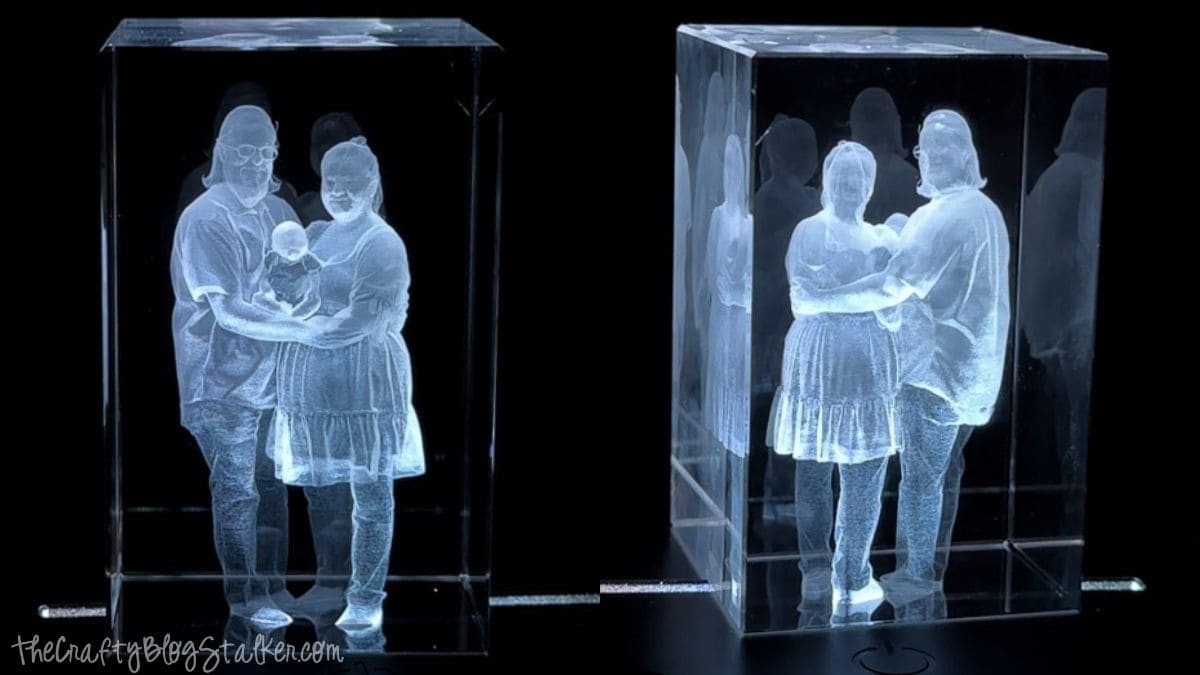 Front and angled views of a 3D inner laser engraved crystal block featuring a family holding a baby, created with the xTool F2 Ultra laser engraver.