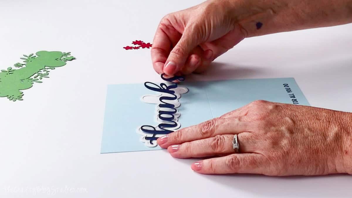 Hands layering blue