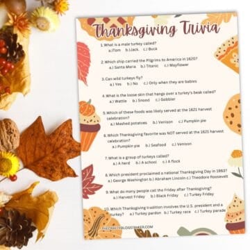 Thanksgiving trivia game sheet with questions and festive decorations.