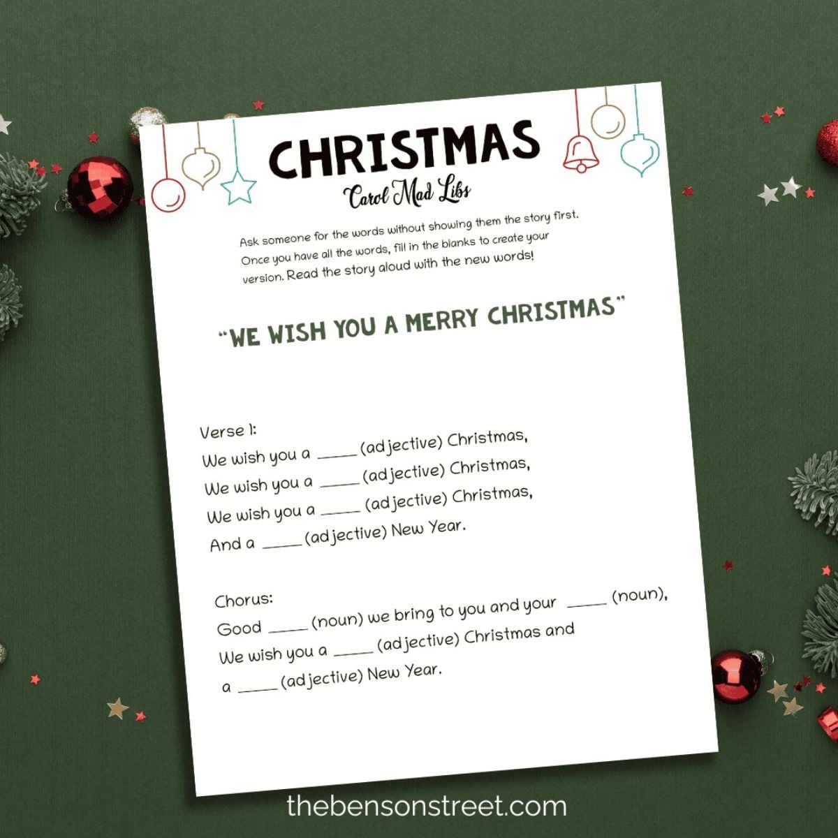 Printable Christmas Carol Mad Libs worksheet with fill-in-the-blank song lyrics, surrounded by red ornaments and greenery on a green background.