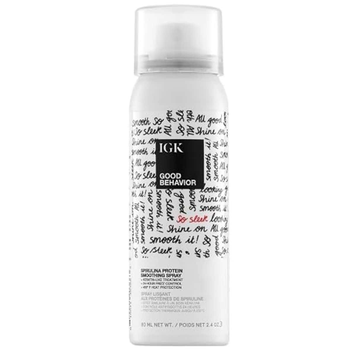 White bottle of IGK Good Behavior Spirulina Protein Smoothing Spray with a clear cap and black handwritten-style label.