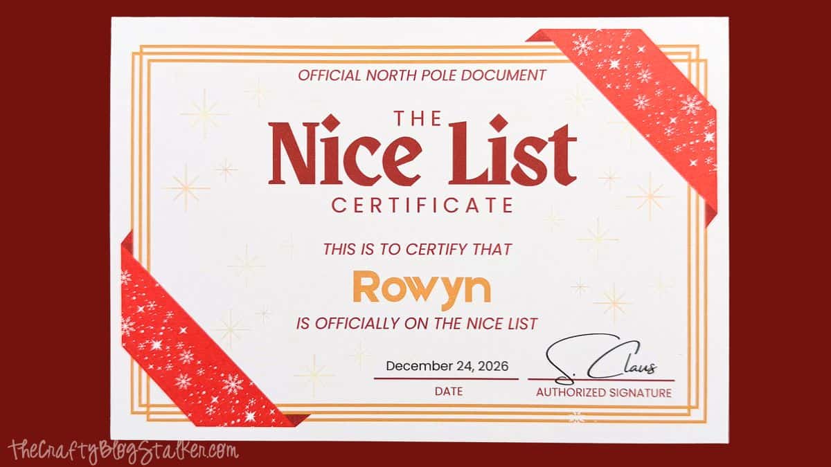 Personalized Official Nice List Certificate for Rowyn with red snowflake ribbon corners, gold borders, and Santa's signature.