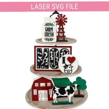Laser SVG file preview featuring farmhouse tiered tray decor with a barn, cow, windmill, Farm Fresh sign, Moo sign, and I Love Cow design.