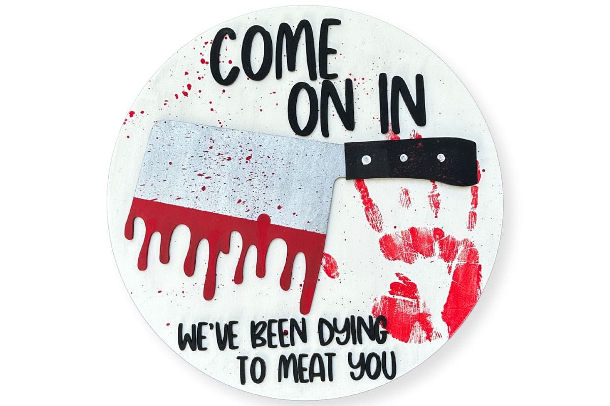 DIY Halloween door hanger that reads 'Dying to Meat You'.