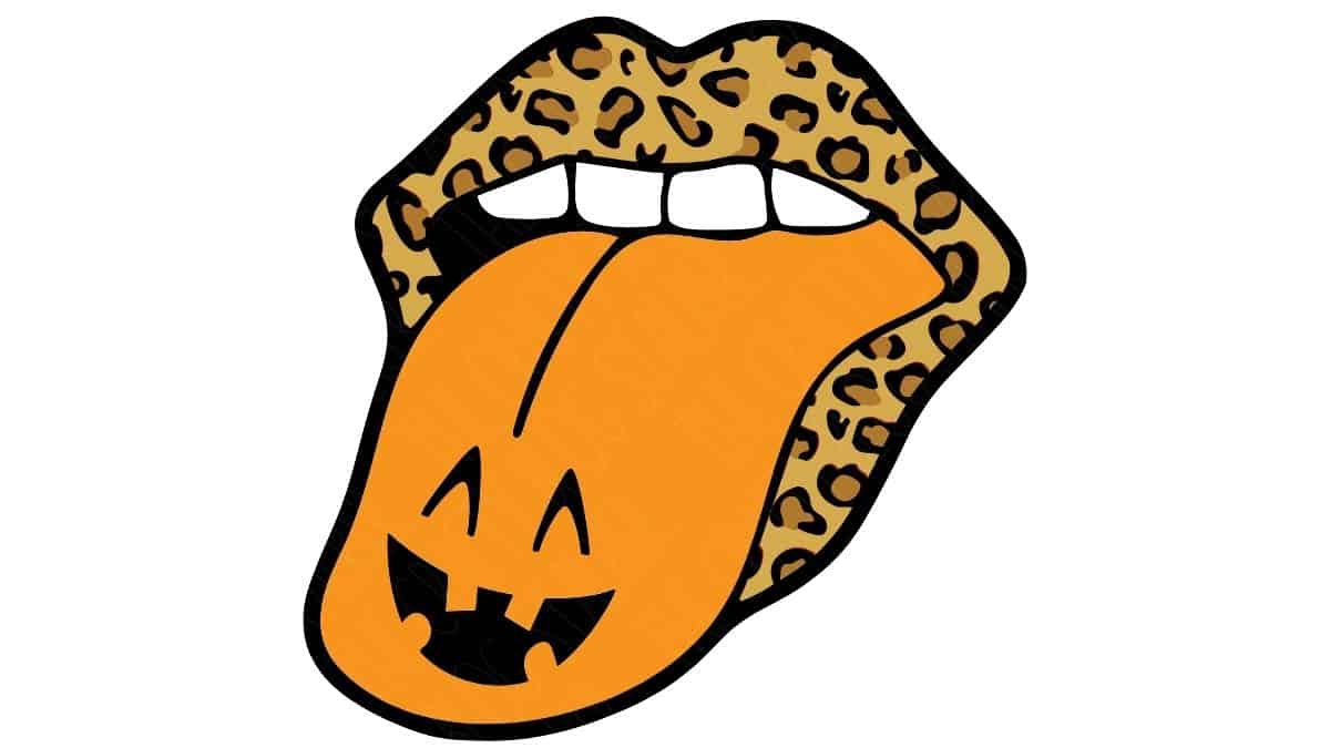 Leopard print lips with an orange tongue shaped like a jack-o'-lantern face, featuring black cutout eyes and mouth for a fun Halloween design.