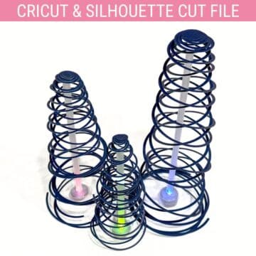 Three spiral cone trees made from coiled paper strips, each standing on a small LED base that glows in different colors.