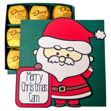 Handmade Santa-themed Christmas chocolate box with a festive card that reads "Merry Christmas Cam," revealing gold-wrapped Dove chocolates inside.
