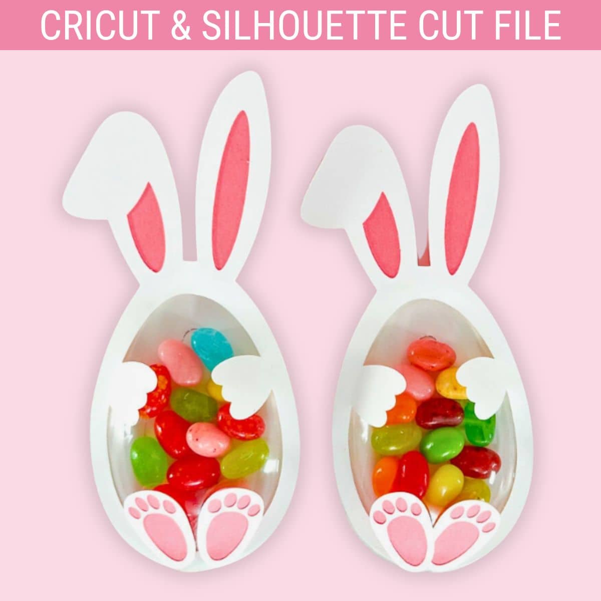 Two Easter bunny treat holders shaped like eggs with ears, paws, and feet, filled with colorful jelly beans, made from a Cricut and Silhouette cut file.