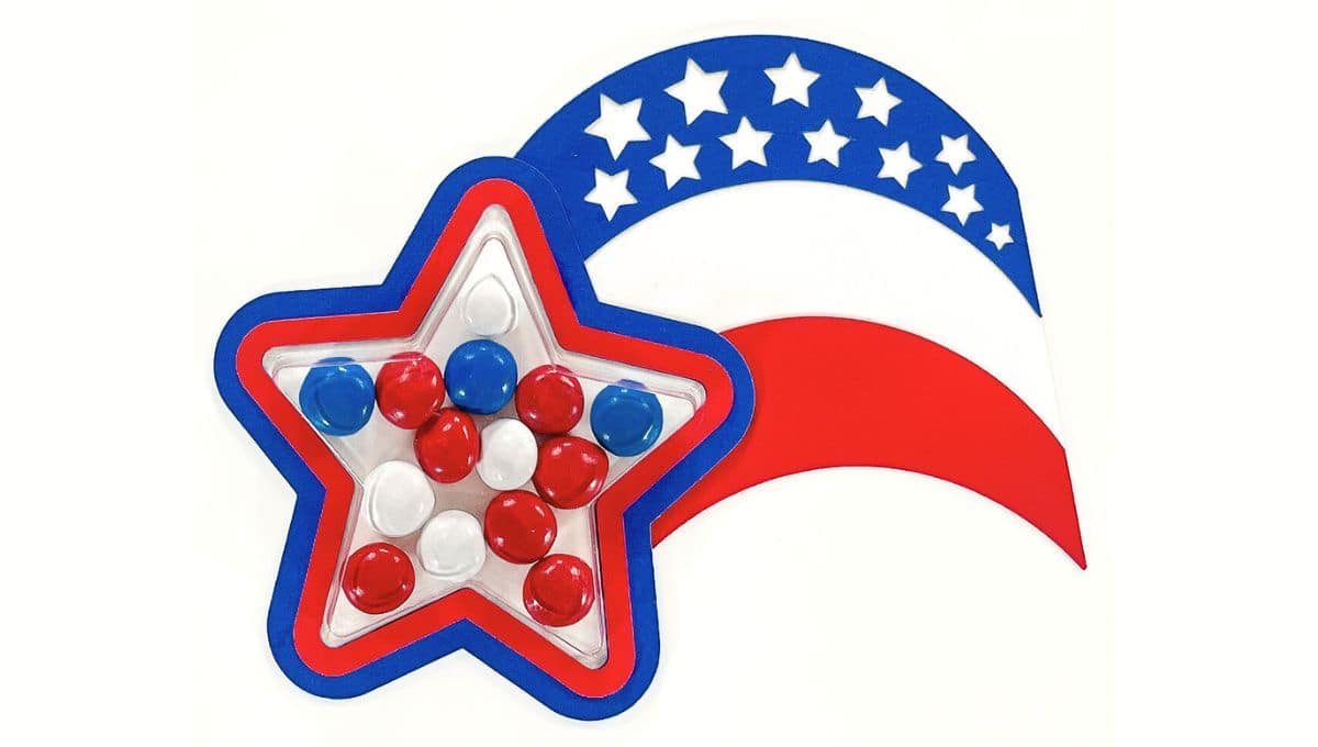 Patriotic star-shaped treat holder filled with red, white, and blue candies, paired with a red, white, and blue arc decorated with cut-out stars.