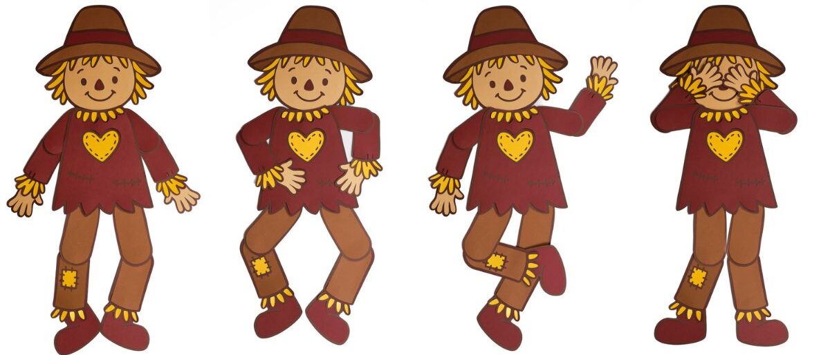 Four paper scarecrow crafts with movable arms and legs, wearing brown hats and red shirts with yellow hearts, shown in different fun poses.