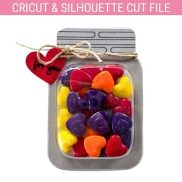 Cricut and Silhouette cut file of a mason jar treat holder filled with colorful heart candies, tied with twine and a red heart tag reading “for you.”