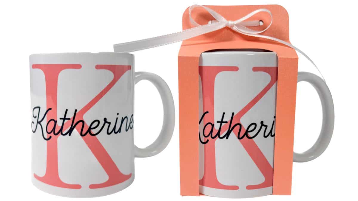 Two personalized mugs with a large letter K and name Katherine, one displayed in a gift box with ribbon and one shown on its own