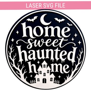 Black and white circular Home Sweet Haunted Home Halloween laser sign with bats, crescent moon, haunted house, trees, and stars.