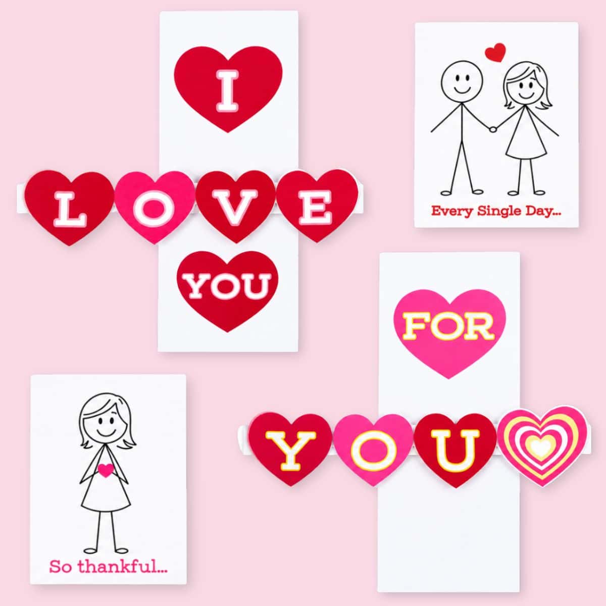 Two handmade Valentine pop-up cards with red and pink hearts spelling 
