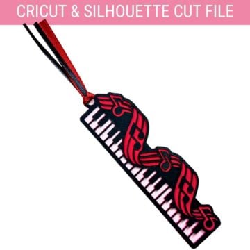 Layered piano bookmark with black and red musical notes, piano keys, and coordinating ribbon.